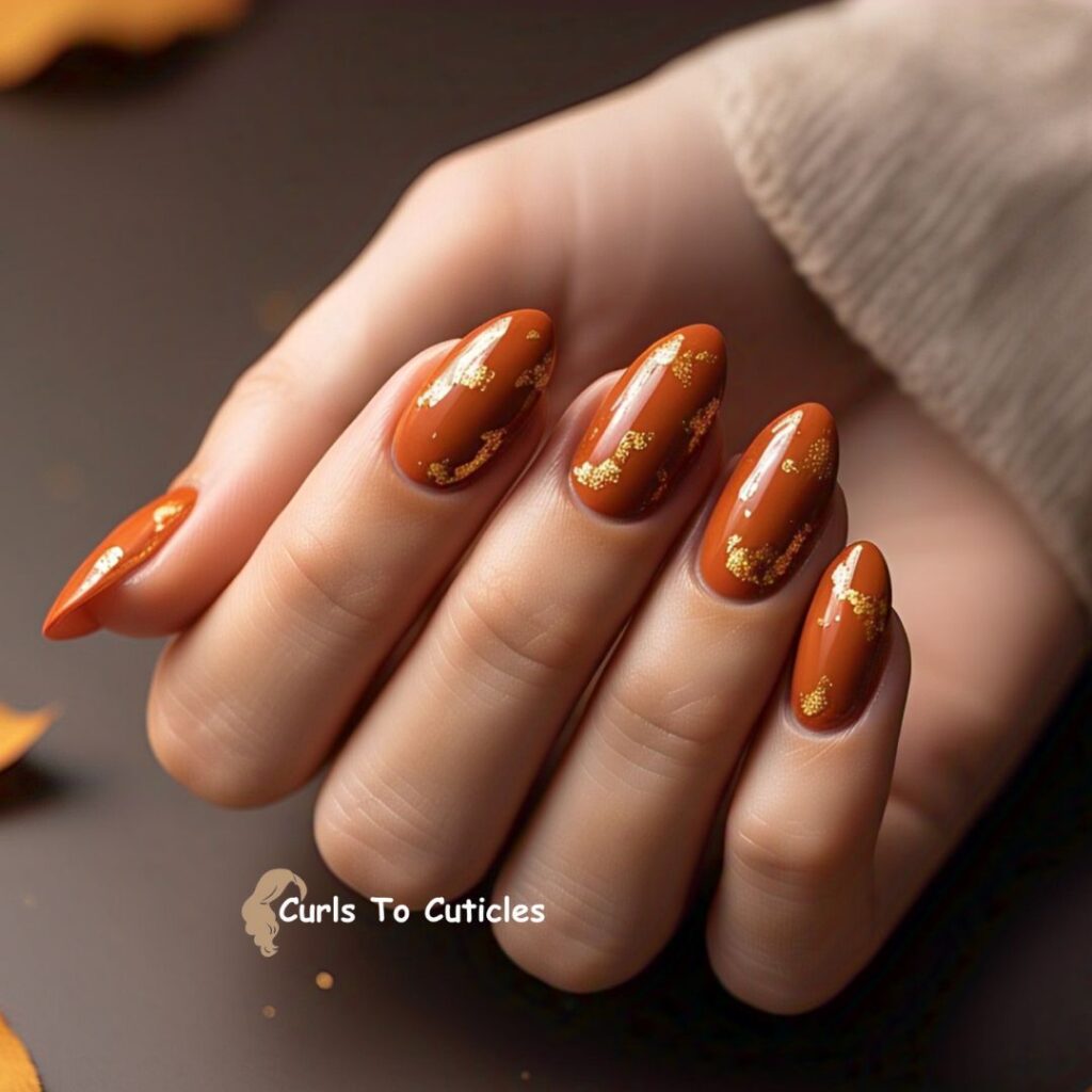 Burnt Orange with Gold Flecks Almond Nails design