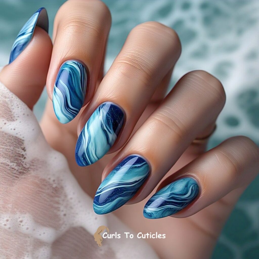 Ocean-Inspired Swirls Aquamarine inspired nail design