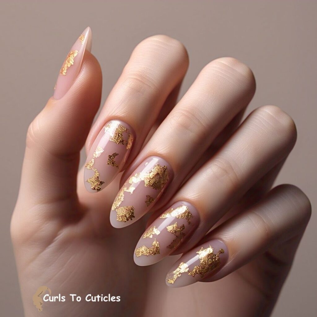 Sheer Pink with Gold Flakes Almond Nails design